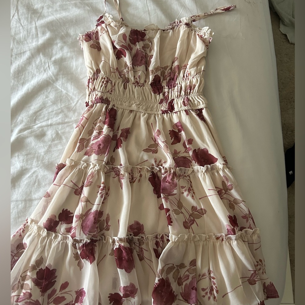 Francesca’s dress never worn. It’s a size small and it has adjustable straps!